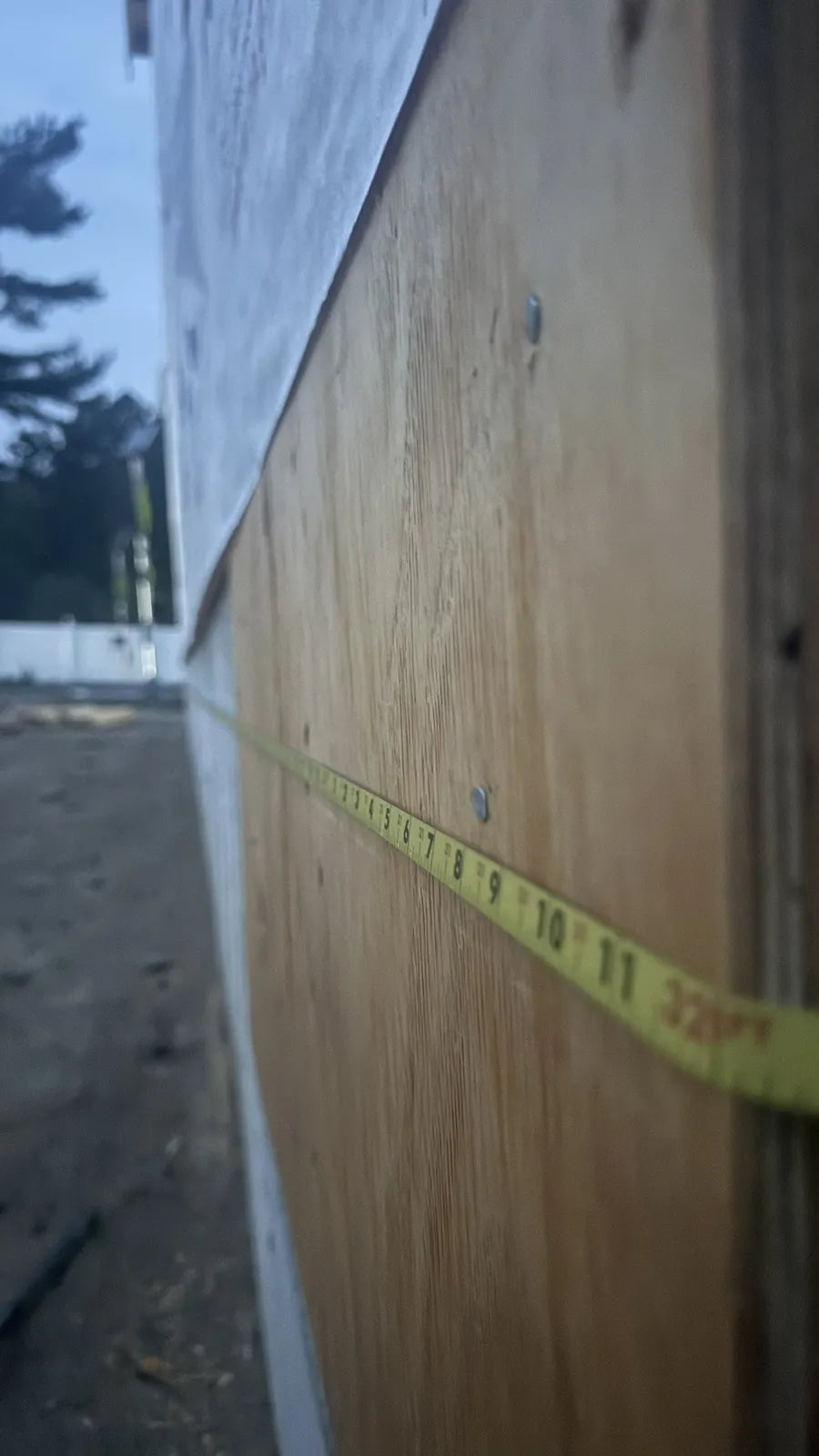 Tape measurement along the North Street house wall